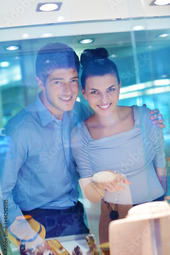 happy young couple in jewelry store