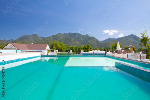 swimming pool besides mountains