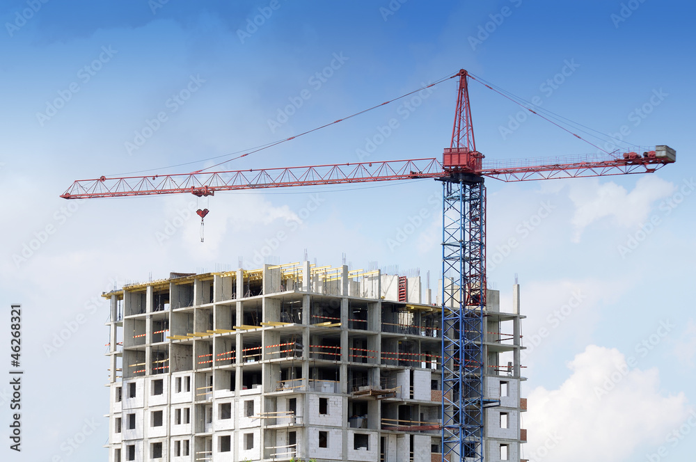 Tower Crane and Unfinished Building at Construction Site