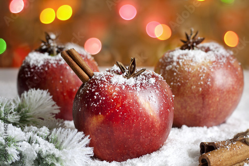 Christmas food apples on snow closeup and blurred background