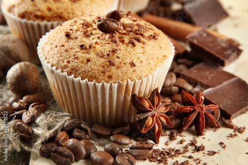 tasty muffin cakes with chocolate, spices and coffee seeds,