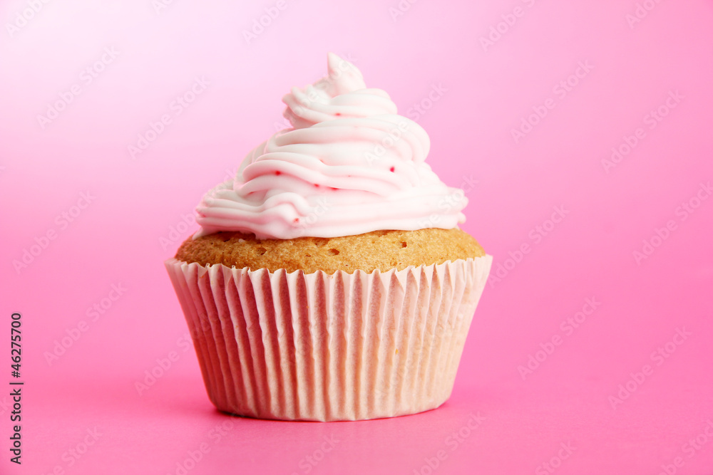 tasty cupcake, on pink background