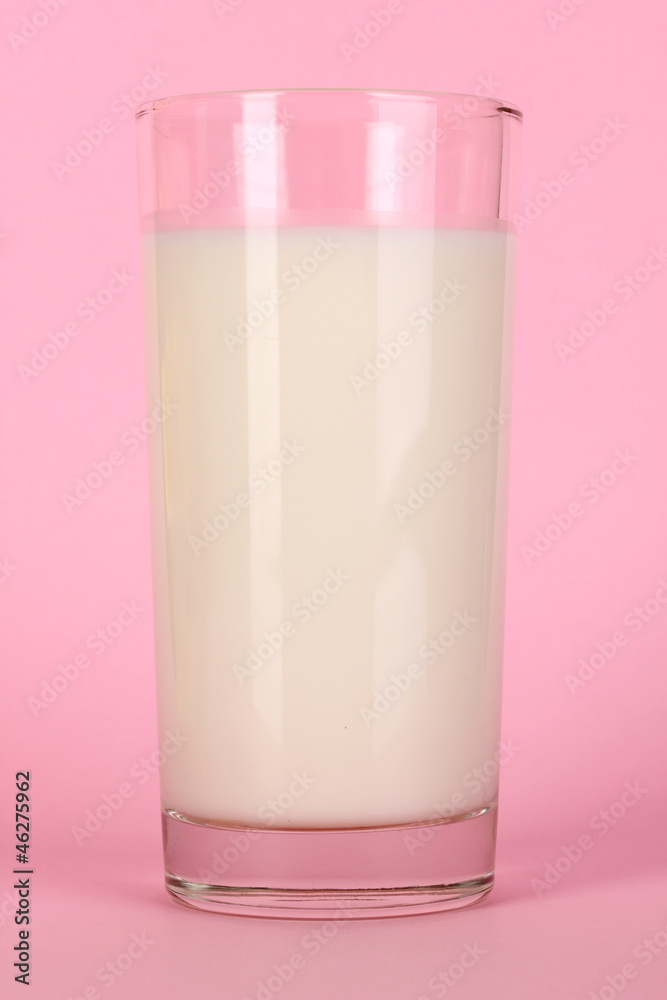 Glass of fresh new milk on pink background Glass of fresh new milk on pink background