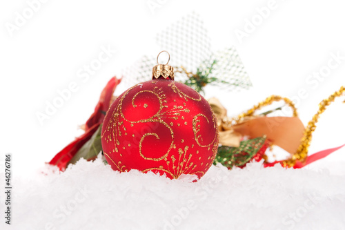 Red christmas ball with snow on white background photo