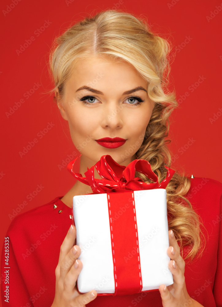lovely woman in red dress with present lovely woman in red dress with present
