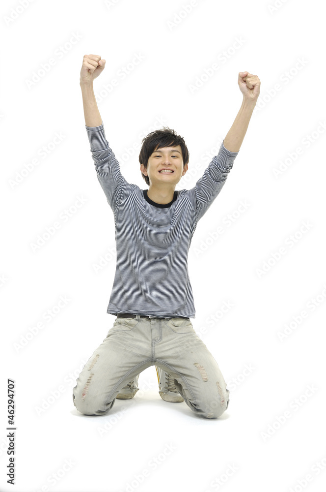 excited young man with hands raised in victory in floor excited young man with hands raised in victory in floor