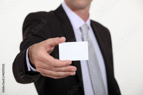 Man holding a blank business card