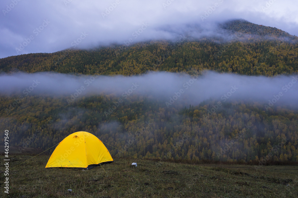 tent facing mountain in autumn