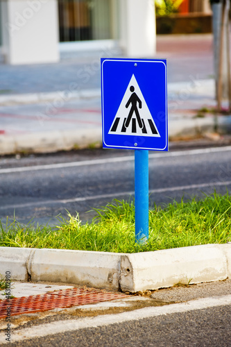 Traffic sign a pedestrian crossing.