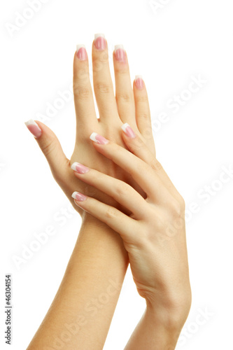 Beautiful woman hands with french manicure  isolated on white