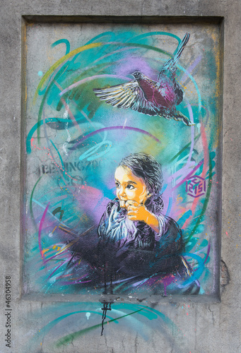 C215 street painting in Oslo girl and bird photo