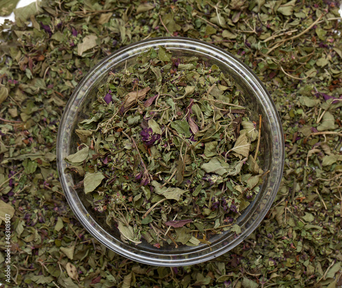dried oregano leaves in a bowl