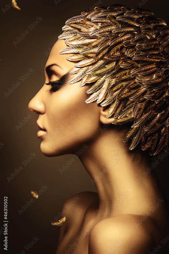 Fototapeta beautiful woman with gold feather hat