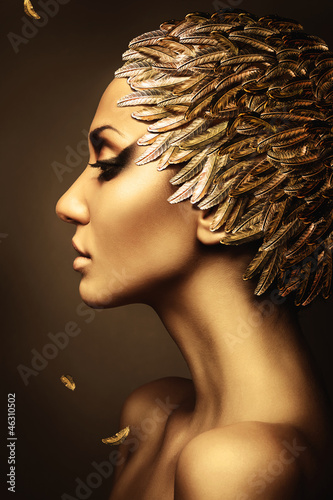 beautiful woman with gold feather hat