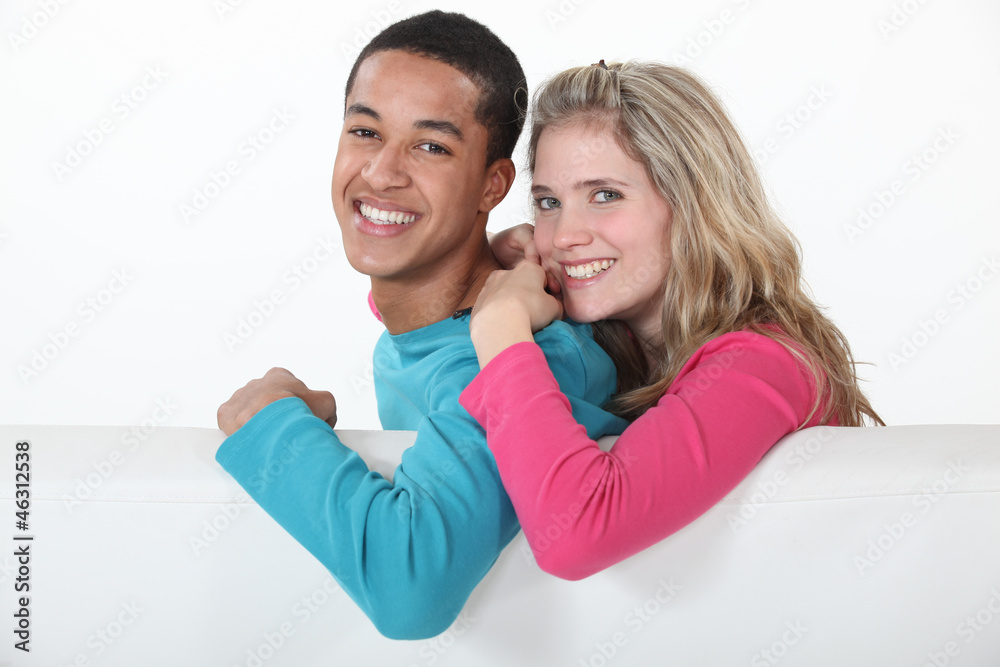Couple relaxing together on sofa Couple relaxing together on sofa