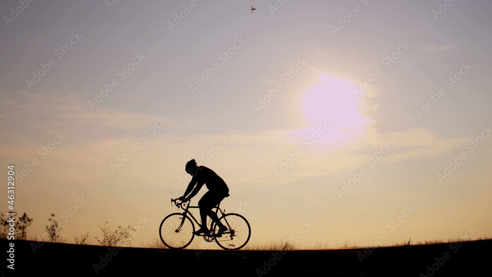 Sunset silhouette healthy living cyclist Sunset silhouette healthy living cyclist