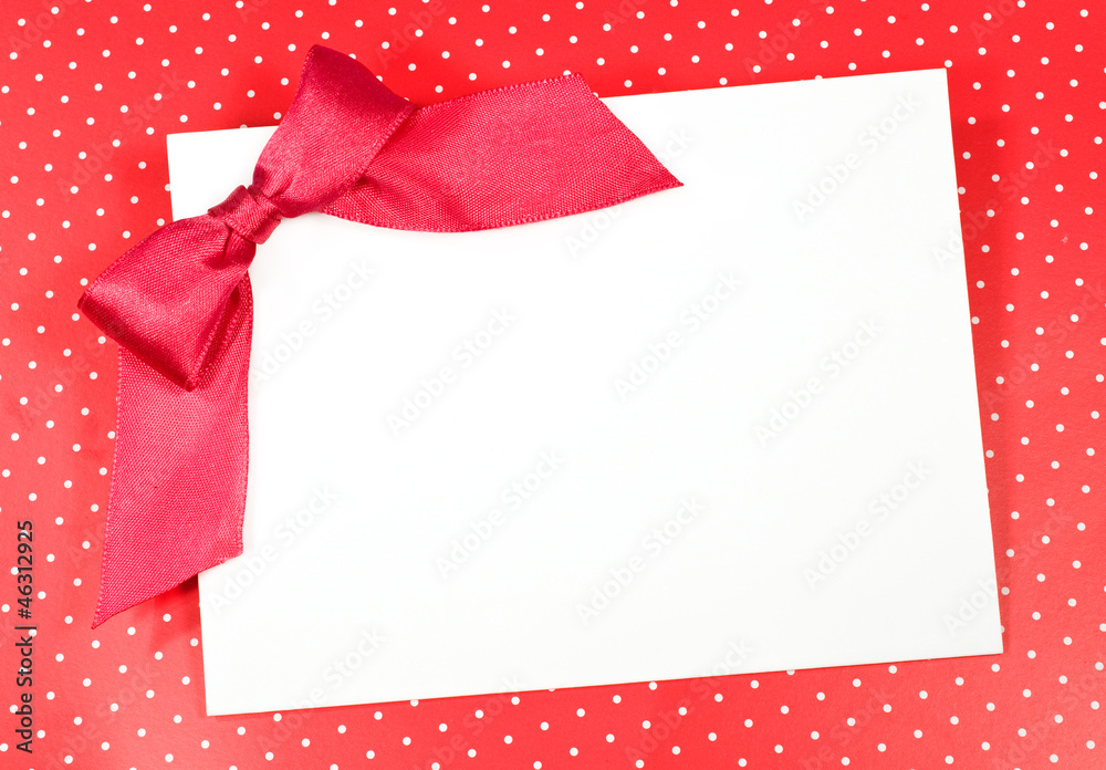blank sheet with a red bow