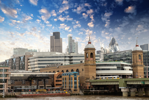 City of London with clouds, financial center and Canary Wharf at © jovannig