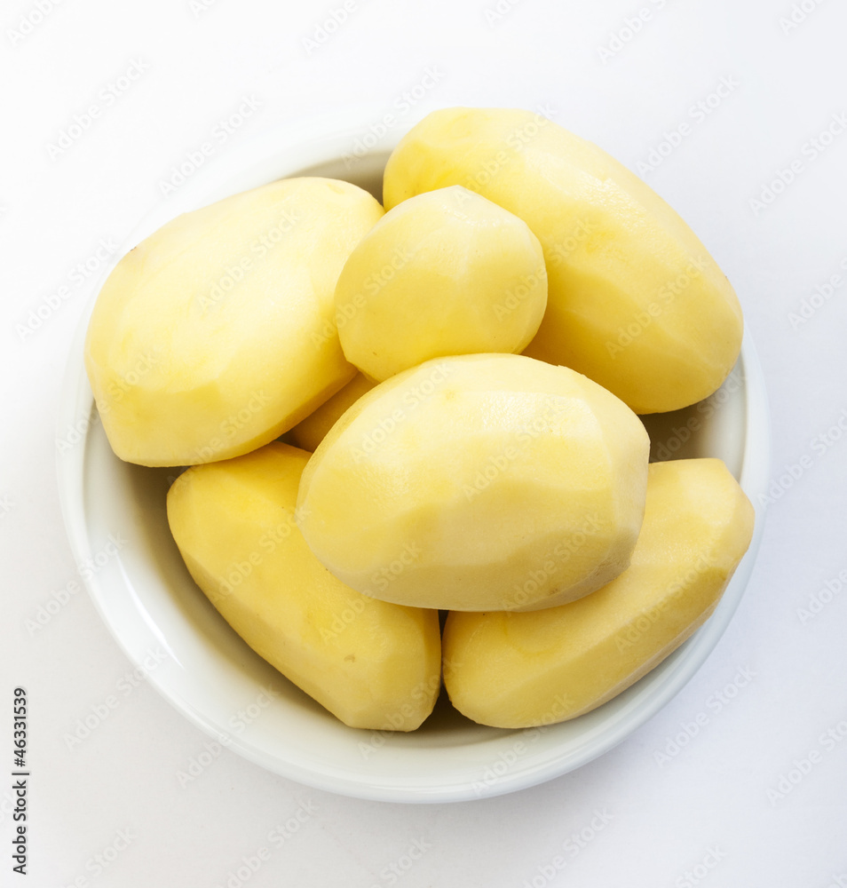 Raw peeled potatoes isolated on a white background