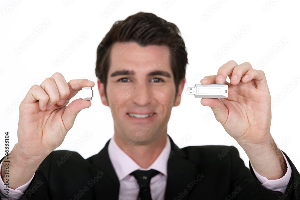 Man holding USB memory stick Man holding USB memory stick