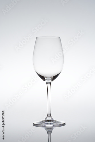 Empty vine glass on gradient background