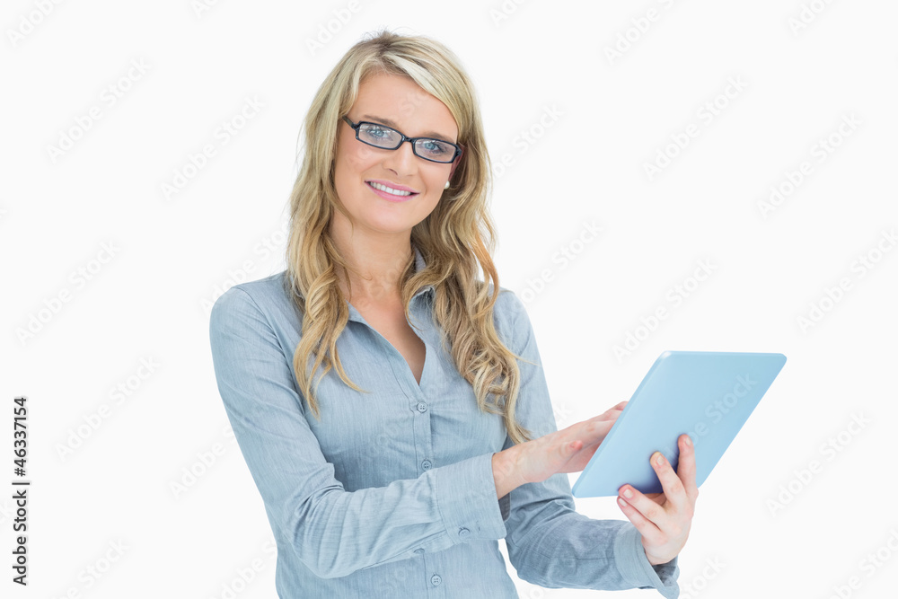 Smiling woman touching on tablet Smiling woman touching on tablet