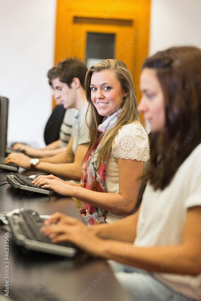 People sitting at the computer smiling People sitting at the computer smiling