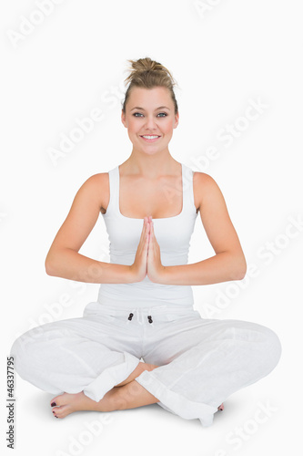 Girl sitting cross-legged in yoga pose