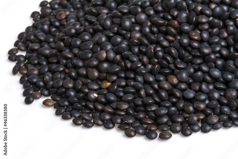 Heap of black lentil isolated on white Heap of black lentil isolated on white