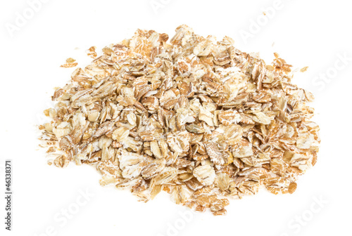 Heap of dry rolled oats isolated on white background