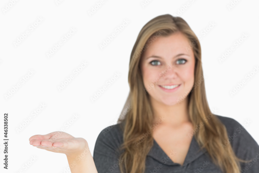Blonde woman presenting with her hand Blonde woman presenting with her hand