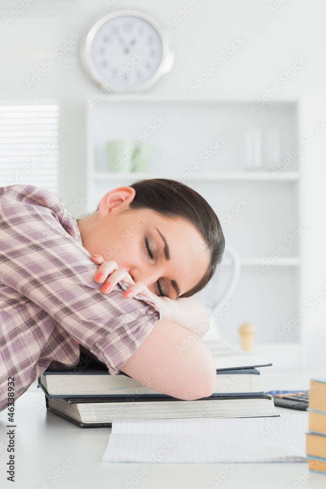 Woman sleeping on books Woman sleeping on books