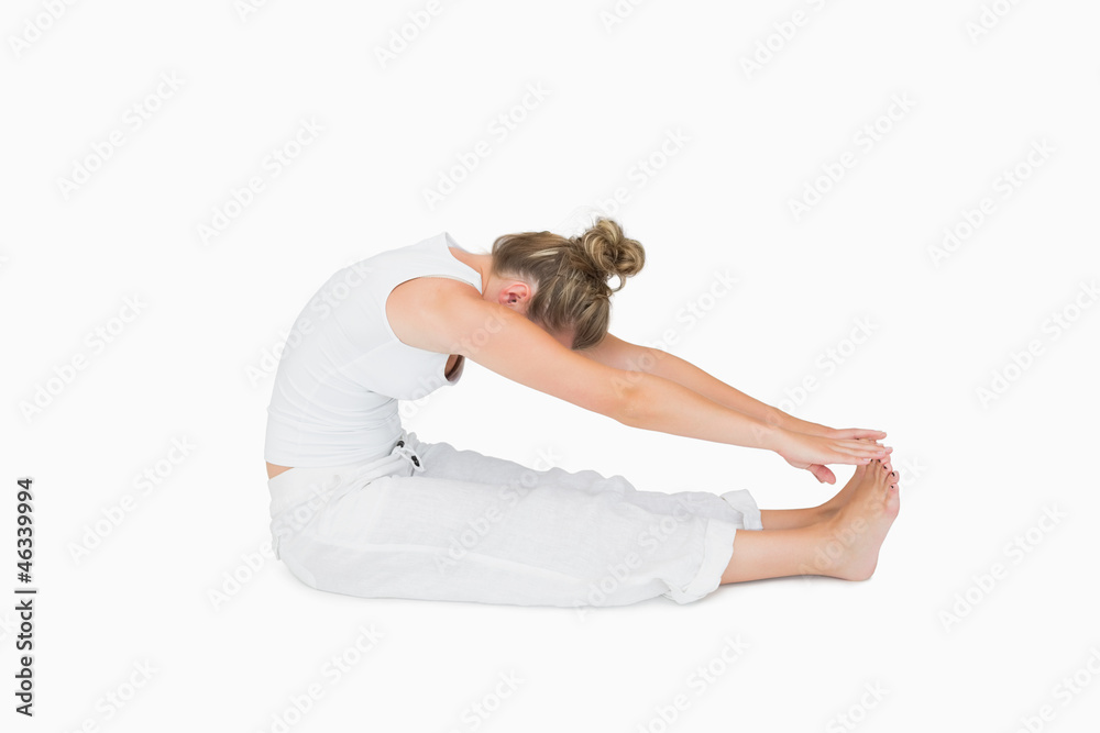 Woman sitting stretching Woman sitting stretching