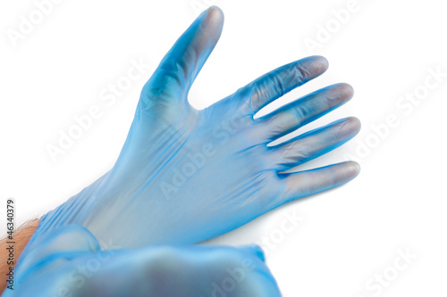 Fototapeta Naklejka Na Ścianę i Meble -  Man putting on rubber gloves