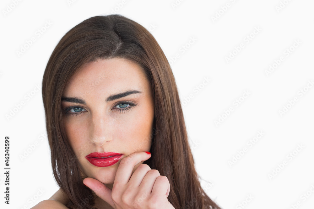 Woman with red lips holding her chin Woman with red lips holding her chin