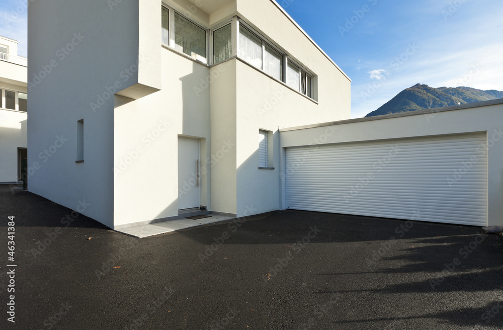 modern house white, view from the courtyard with garage modern house white, view from the courtyard with garage