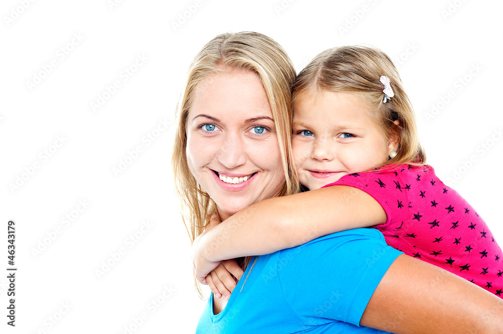 Daughter enjoying piggy ride. Playful mother Daughter enjoying piggy ride. Playful mother