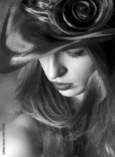 Portrait of the girl in a hat. Black and white