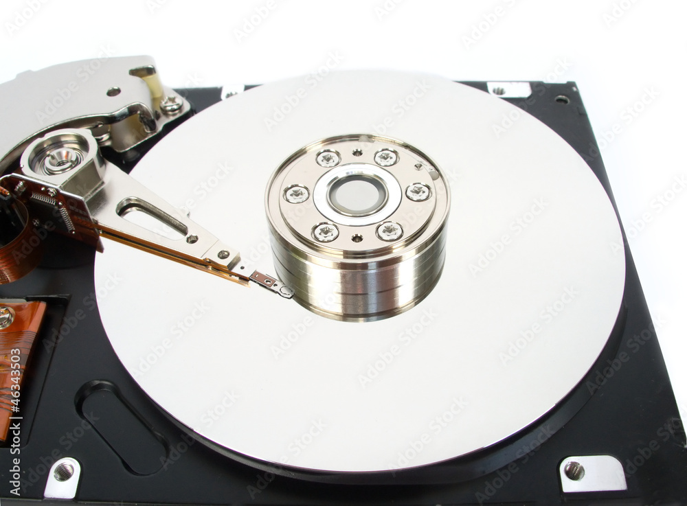 Opened computer hard disk drive isolated on white closeup Opened computer hard disk drive isolated on white closeup