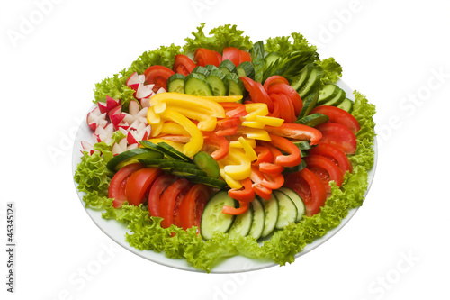 Plate of sliced vegetables isolated on white with clipping path