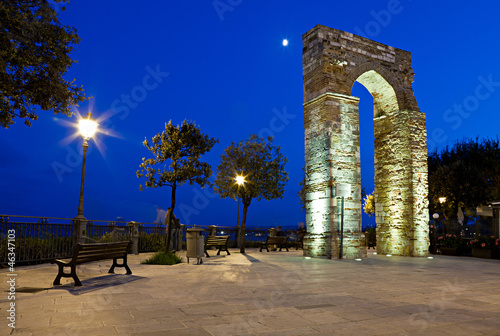 Numana, l'Arco di Torre all'imbrunire con la luna photo