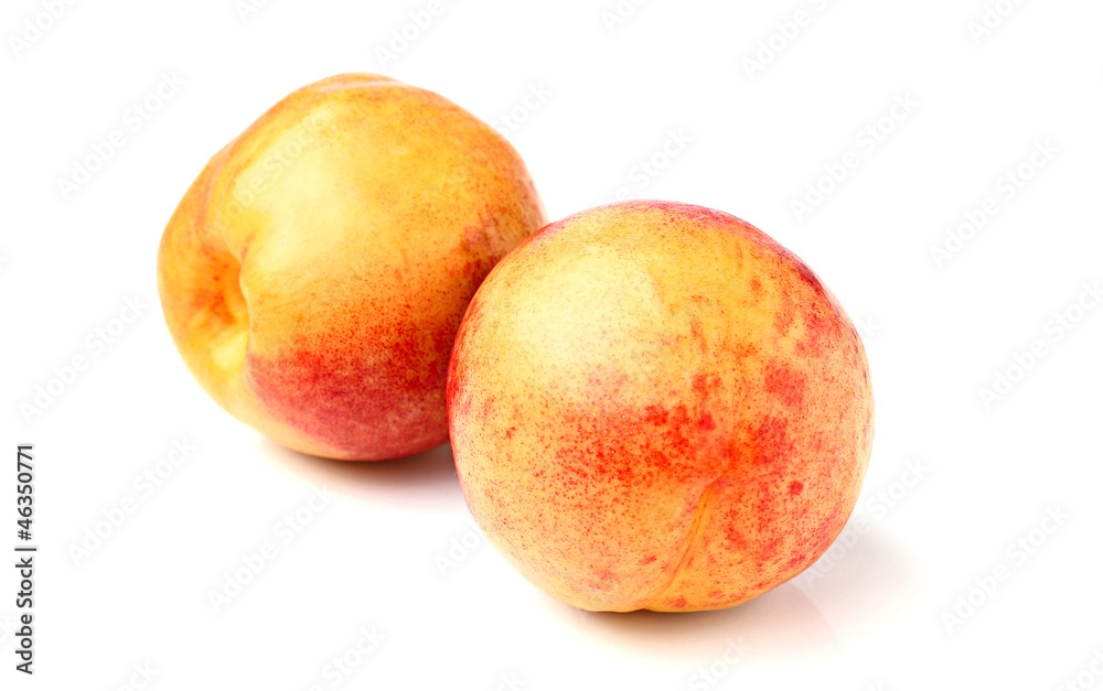 Two ripe peaches isolated on white background Two ripe peaches isolated on white background