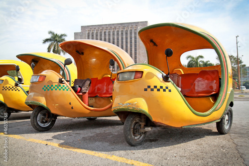 Photography Yellow coco taxi in  Havana