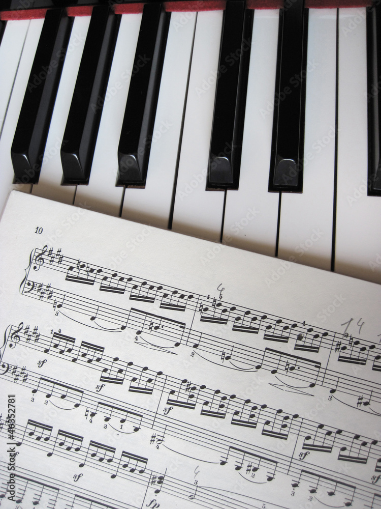 Fototapeta premium Piano keys with notes, musical background.
