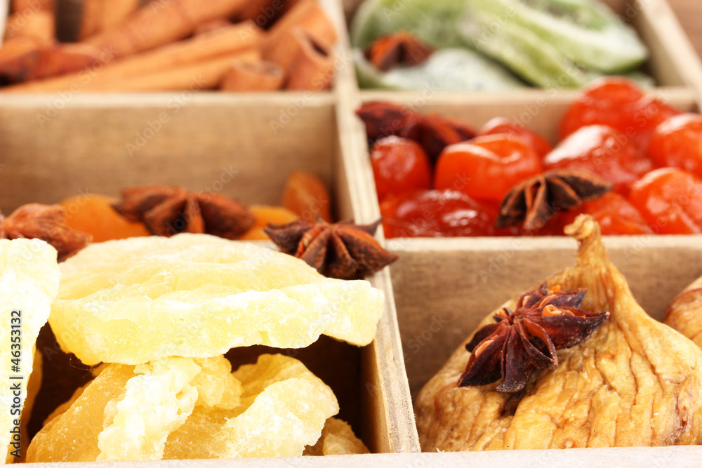 Dried fruits and cinnamon with anise stars in box close-up