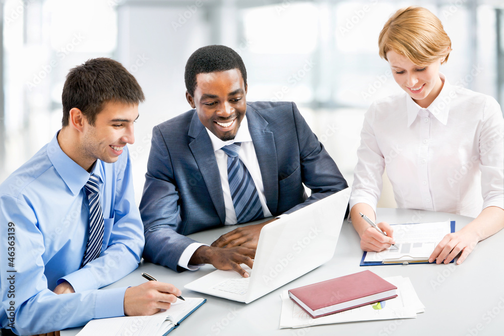 Businesspeople working at meeting Businesspeople working at meeting