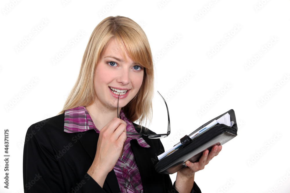 Female office worker with a diary Female office worker with a diary