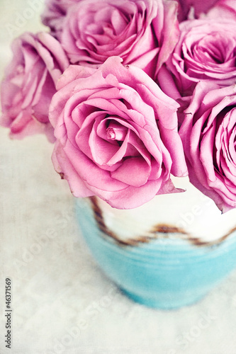 pink roses on a table.