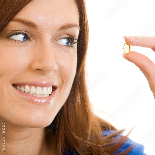Cheerful woman with Omega 3 fish oil, over white