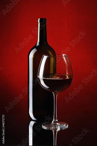 Special red wine bottle with glass